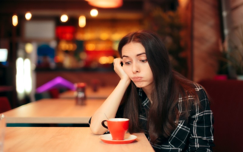bored girl waiting at table