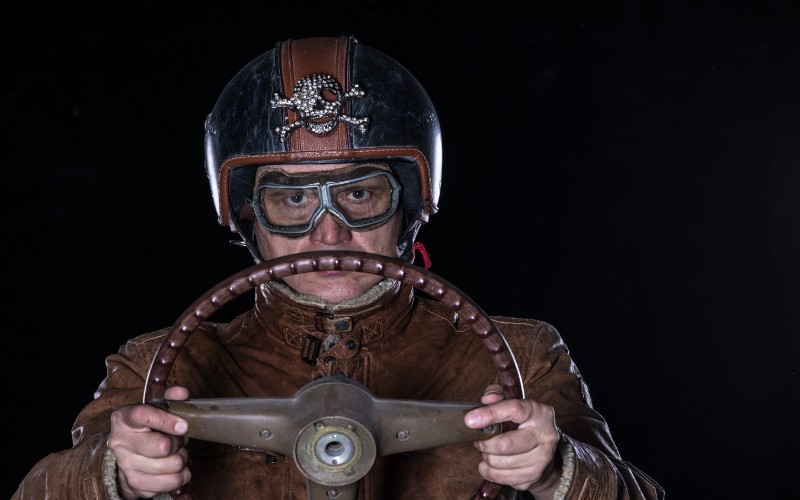 Vintage Race Car Driver wearing helmet and protective glasses