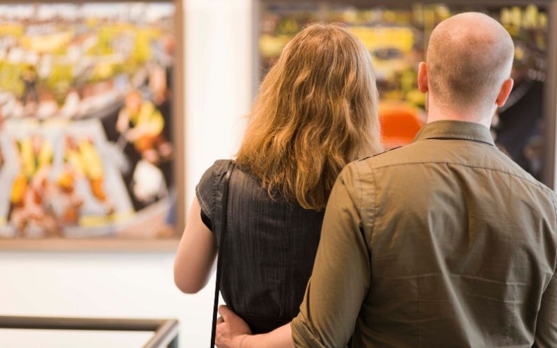 couple looking at art in museum