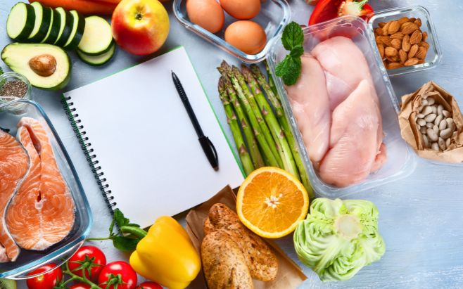 notepad surrounded by healthy foods